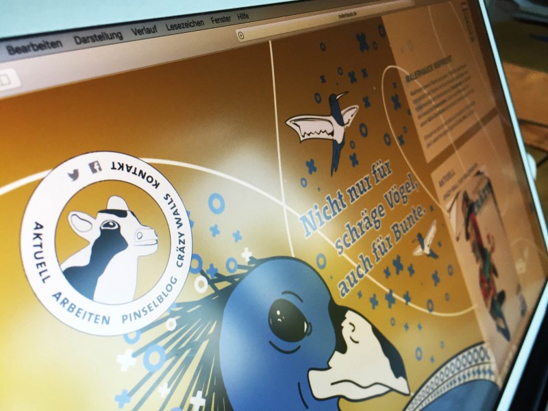 Website mit Grafiken von einer Kuh und einem Vogel